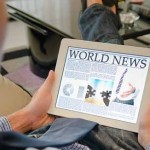 Reading news on a tablet from iStockphoto Reading news on a tablet from iStockphoto