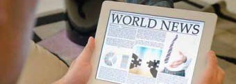 Reading news on a tablet from iStockphoto Reading news on a tablet from iStockphoto