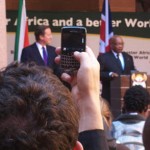 Man taking picture of David Cameron and Jacob Zuma with a mobile phone by Ken Banks, kiwanja.net, from Flickr Man taking picture of David Cameron and Jacob Zuma with a mobile phone by Ken Banks, kiwanja.net, from Flickr