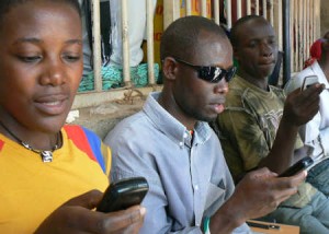 Texting in Uganda by Ken Banks from Flickr